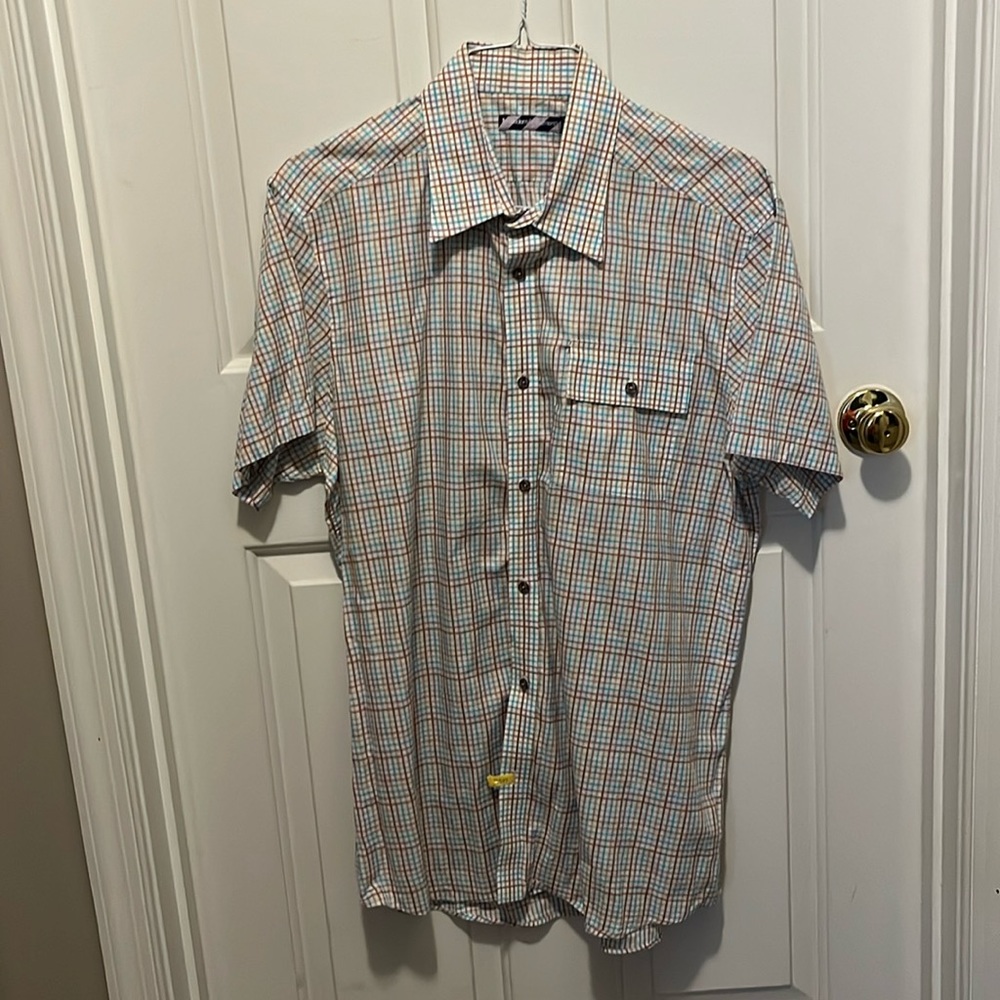Modern Amusement short sleeve multi color striped shirt with pocket.